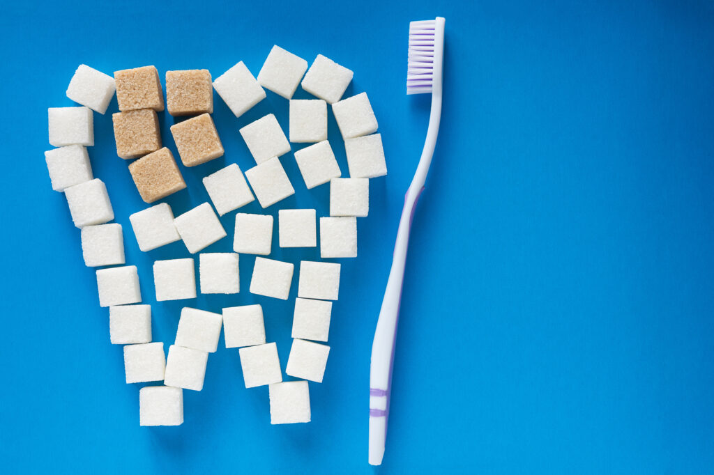 The carious tooth of sugar cubes of refined sugar, preventing to